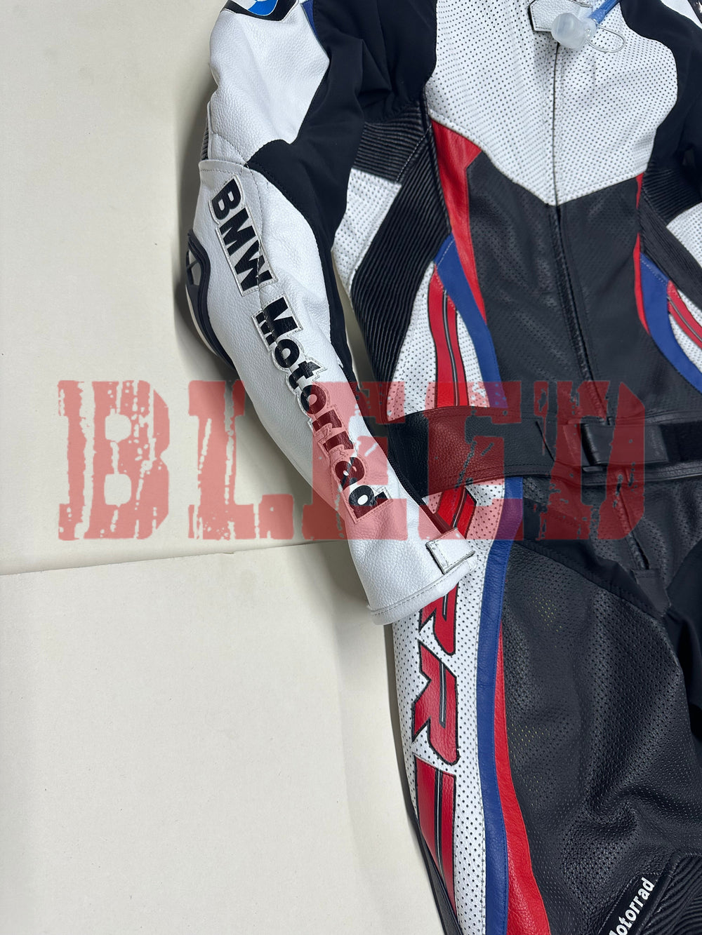 Close-up side view of the BMW Double R Men's Motorbike Race Suit, highlighting the white sleeve with 'BMW Motorrad' branding and the black, red, and blue accents running down the side of the suit.