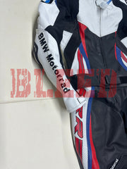 Close-up side view of the BMW Double R Men's Motorbike Race Suit, highlighting the white sleeve with 'BMW Motorrad' branding and the black, red, and blue accents running down the side of the suit.