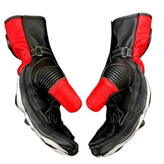A pair of black leather motorcycle gloves with bright red accents on the palms and back cuffs, shown against a plain white background.