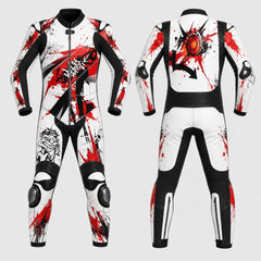 Front and back views of a full-body racing suit with a white base, black panels, and bold red paint-splatter graphics, shown on a light gray background.