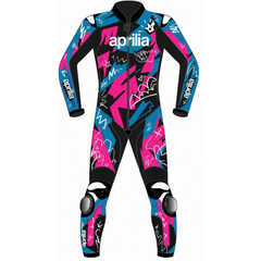 A full-body wetsuit with a black base and a vibrant graphic print in pink and blue, featuring the brand name 'aprilia' printed across the chest and on the sleeves.